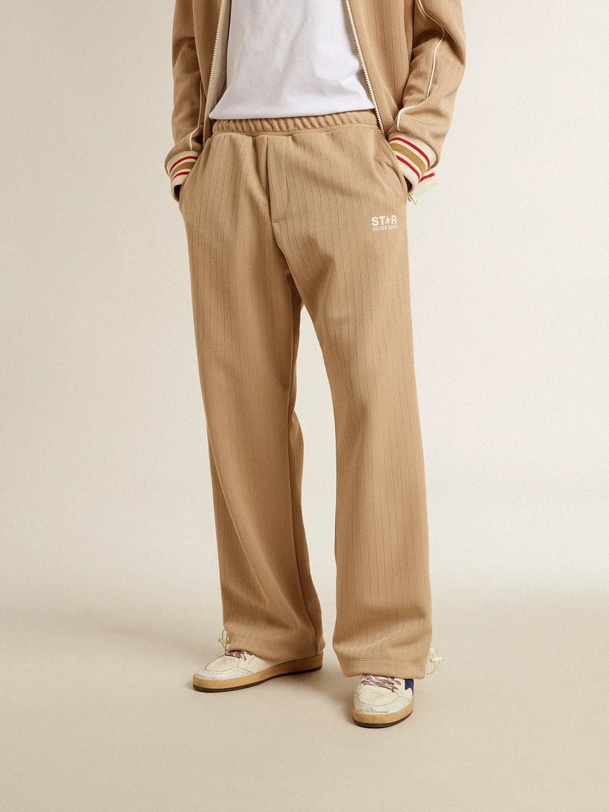 Men’s light beige joggers with white logo