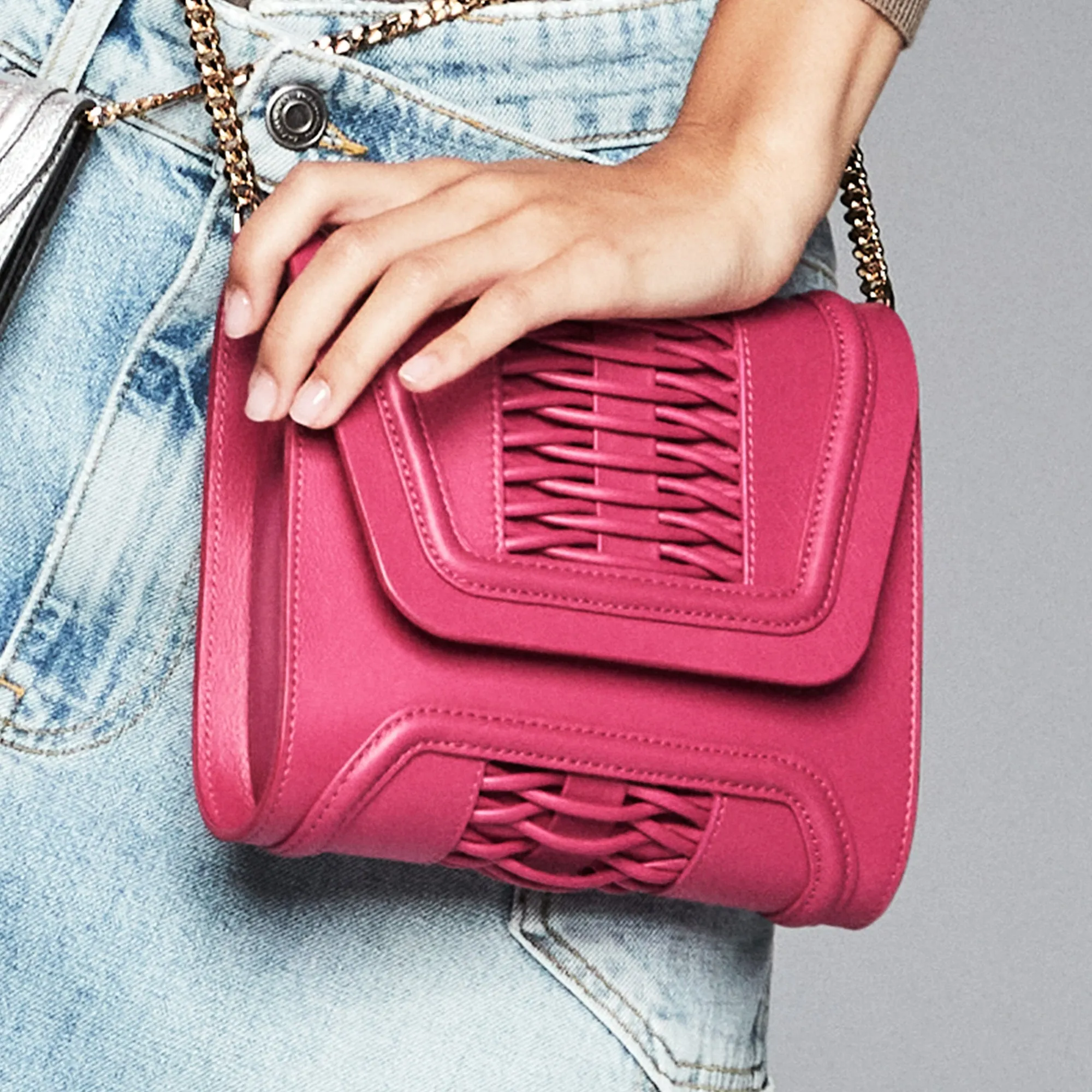 Mini Giovanna fuchsia braided clutch